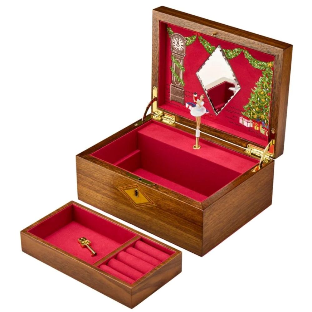 Wooden jewelry box with red interior, decorative lid, and key 