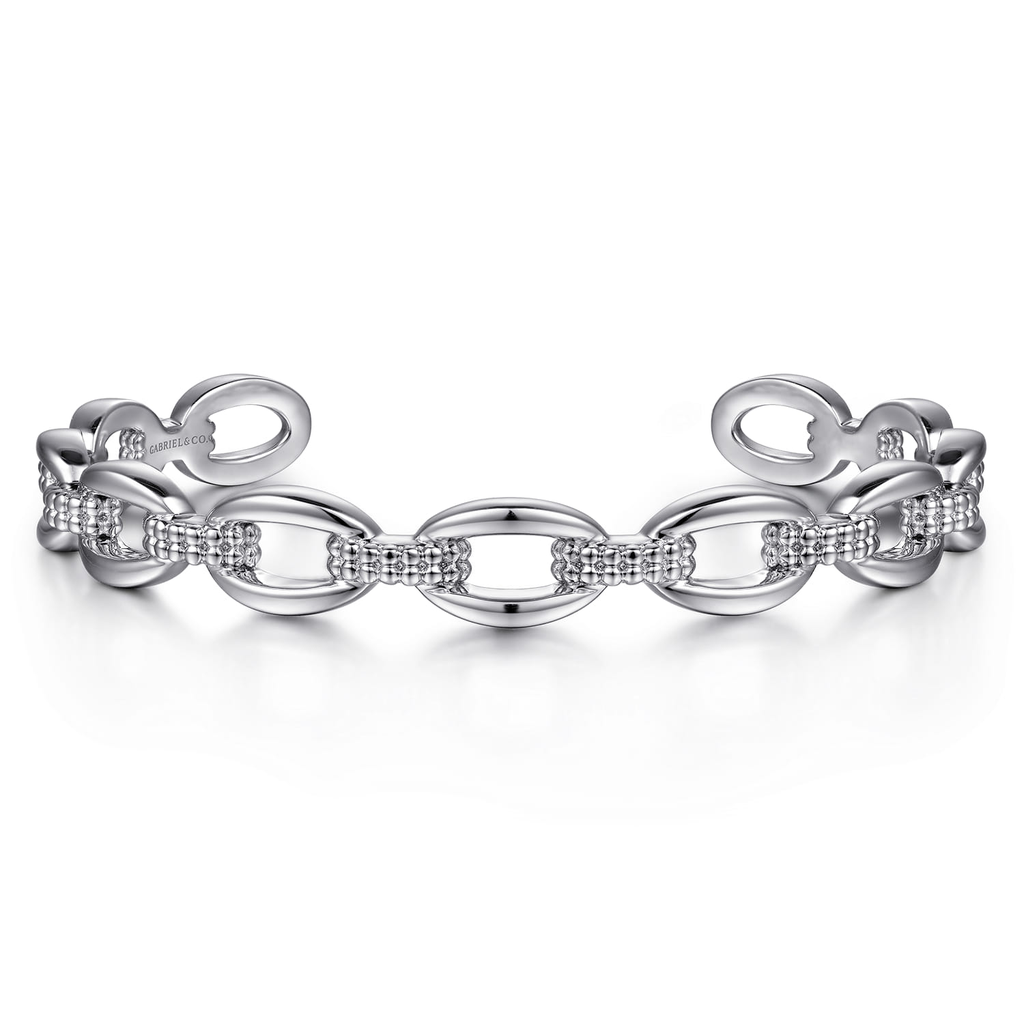 Silver bracelet with interlocking links on a white background