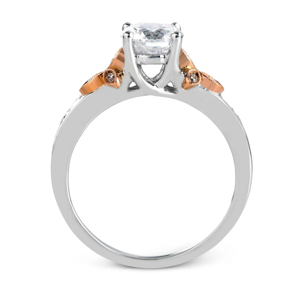 Two-tone ring with a central diamond and smaller diamonds on the shoulders against a white background