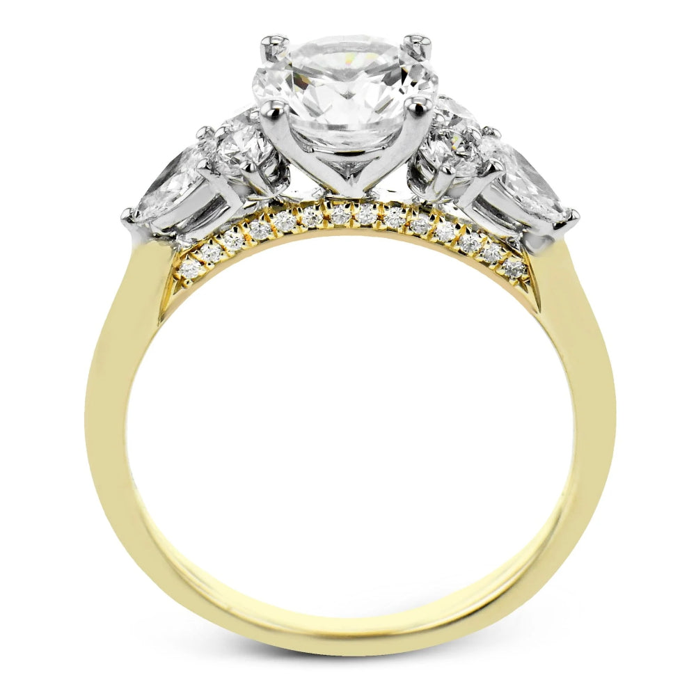 Gold and silver ring with diamonds on a white background