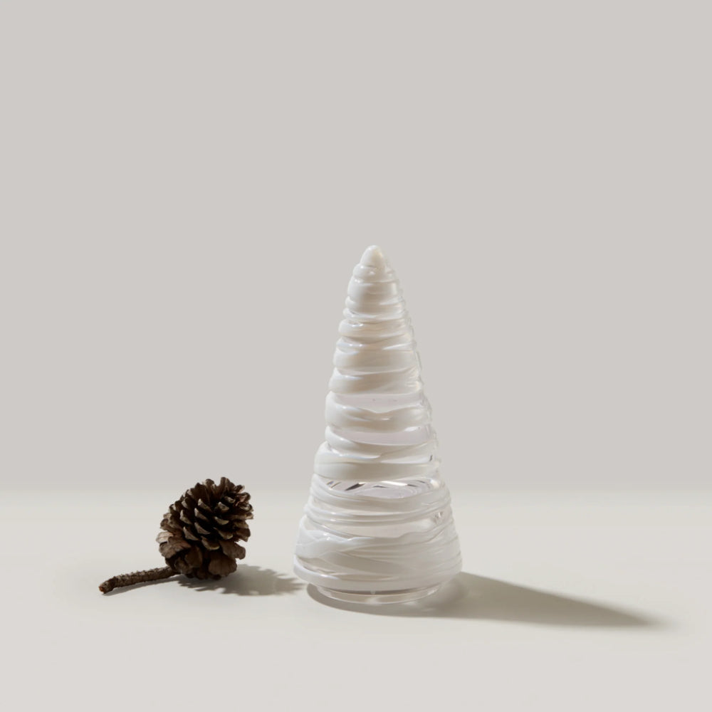 Decorative cone-shaped object with a pine cone on a light background