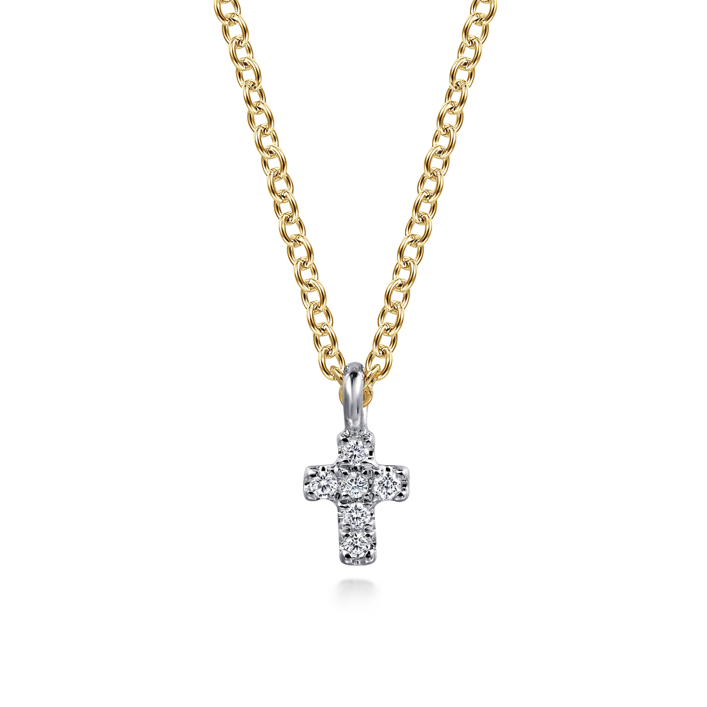 silver cross with yellow chain on white background