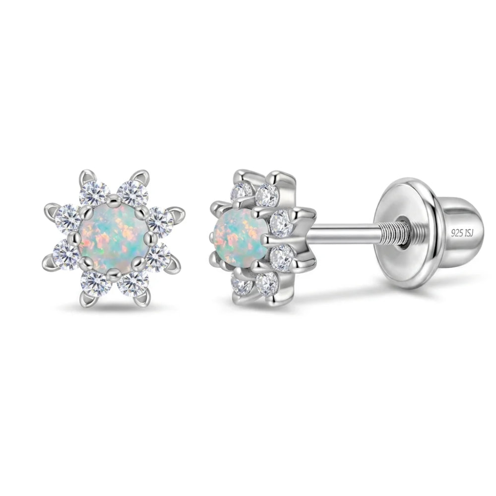 A pair of silver stud earrings featuring a central round iridescent opal surrounded by six clear accent stones, shown on a clean white background. One earring is facing forward, and the other is angled to show the post and butterfly back.