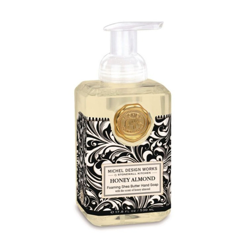 Foaming hand soap bottle with decorative label on a white background