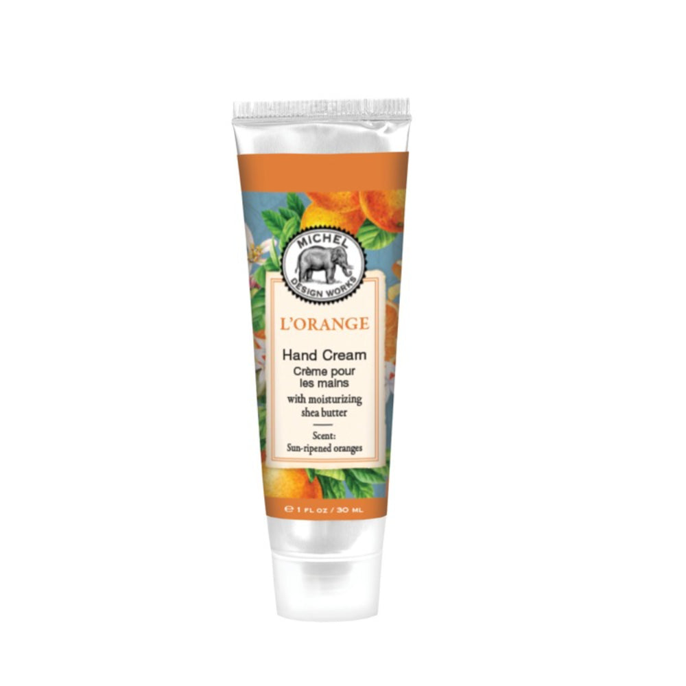 Hand cream tube with orange and green design on a white background
