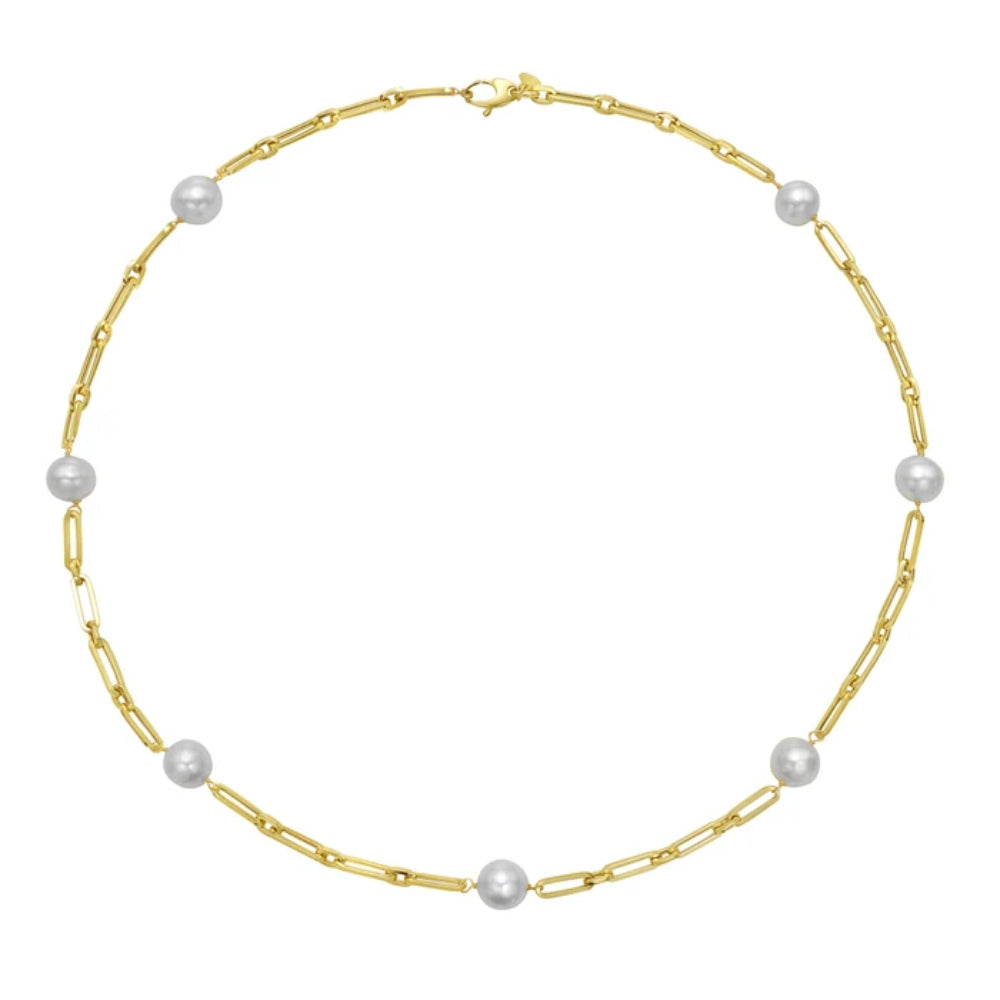 gold necklace with pearl stations on white background