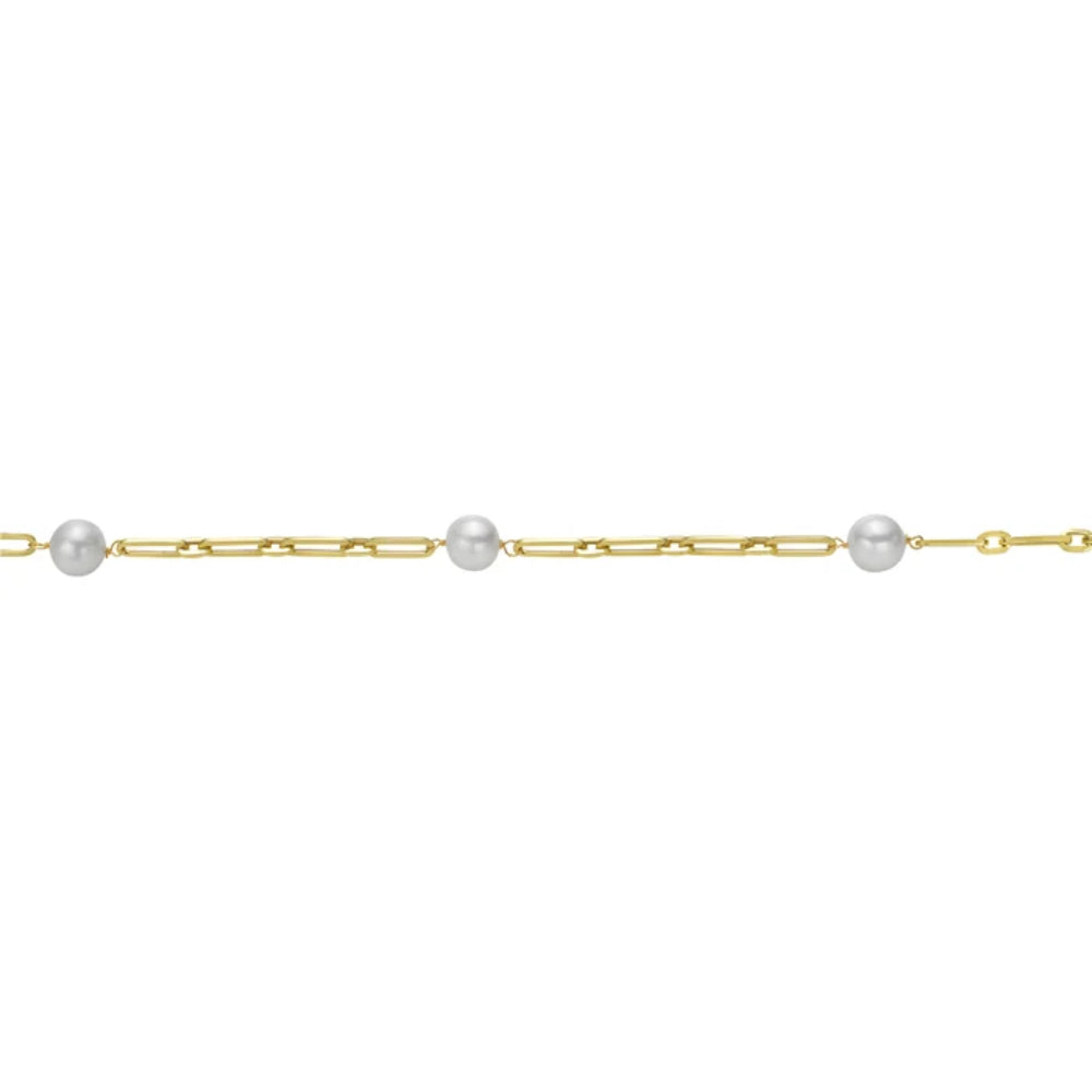 A delicate gold chain bracelet featuring three evenly spaced white freshwater pearls, shown against a plain white background.