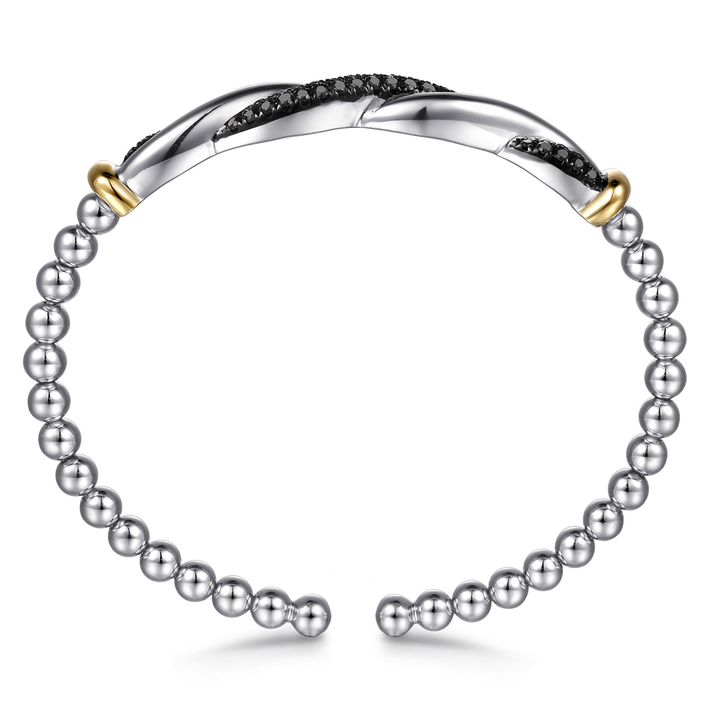 Silver beaded bracelet with gold accents on a white background
