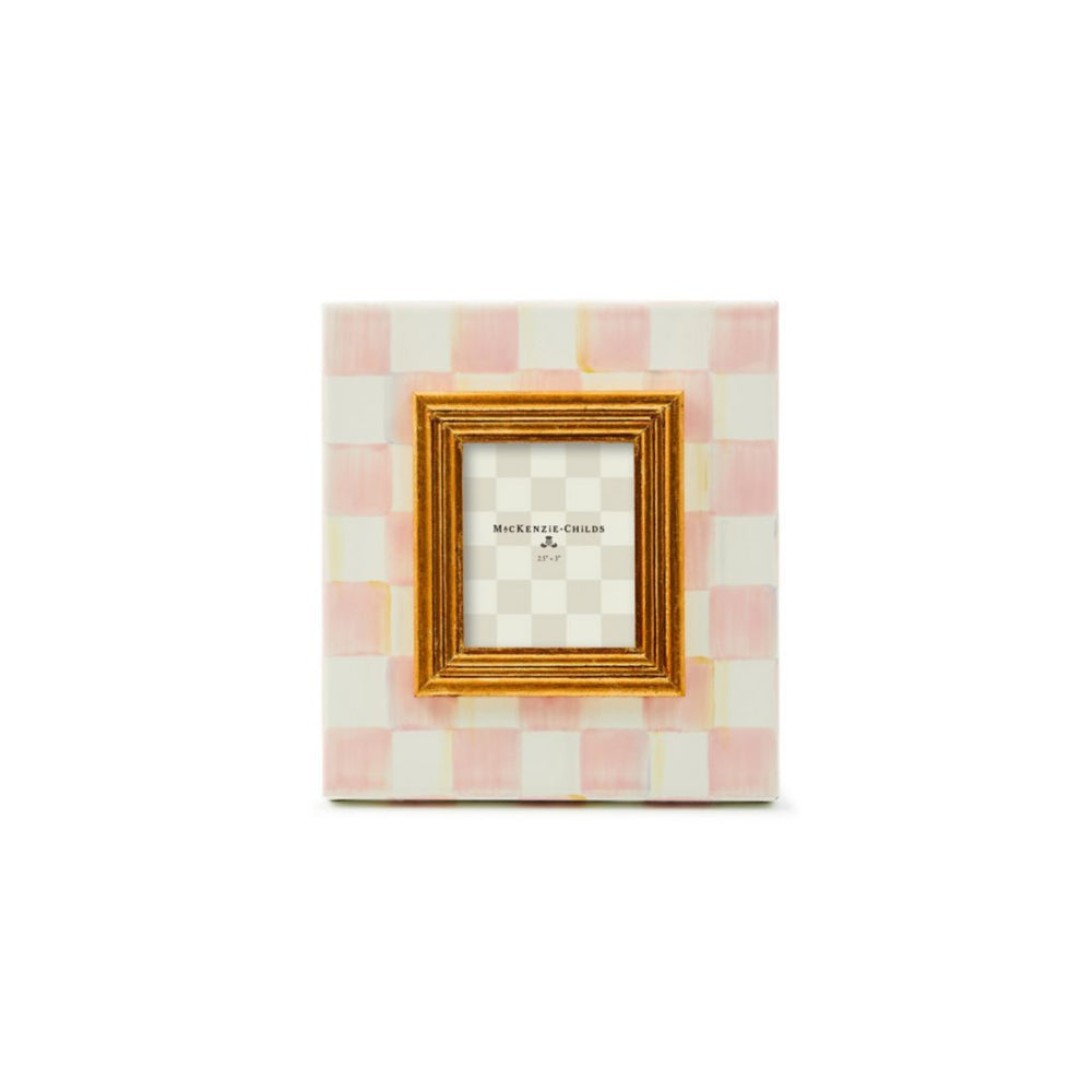 Hand-painted Rosy Check pattern picture frame with a brass logo plate, backed with linen, displaying a photo.
