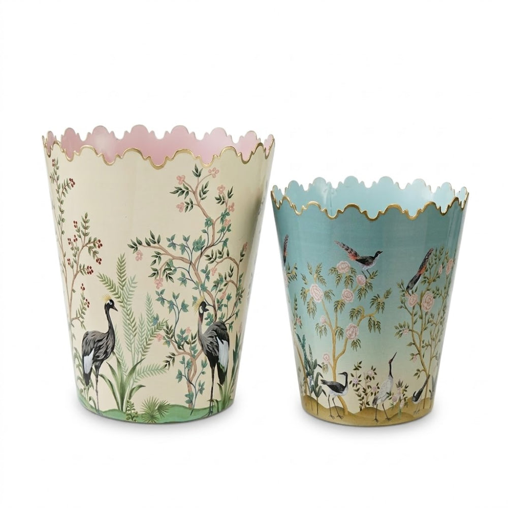Two decorative buckets with nature-themed designs on a white background