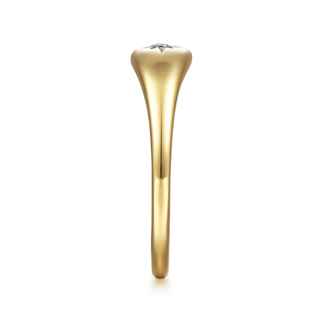 Gold ring with a diamond on a white background