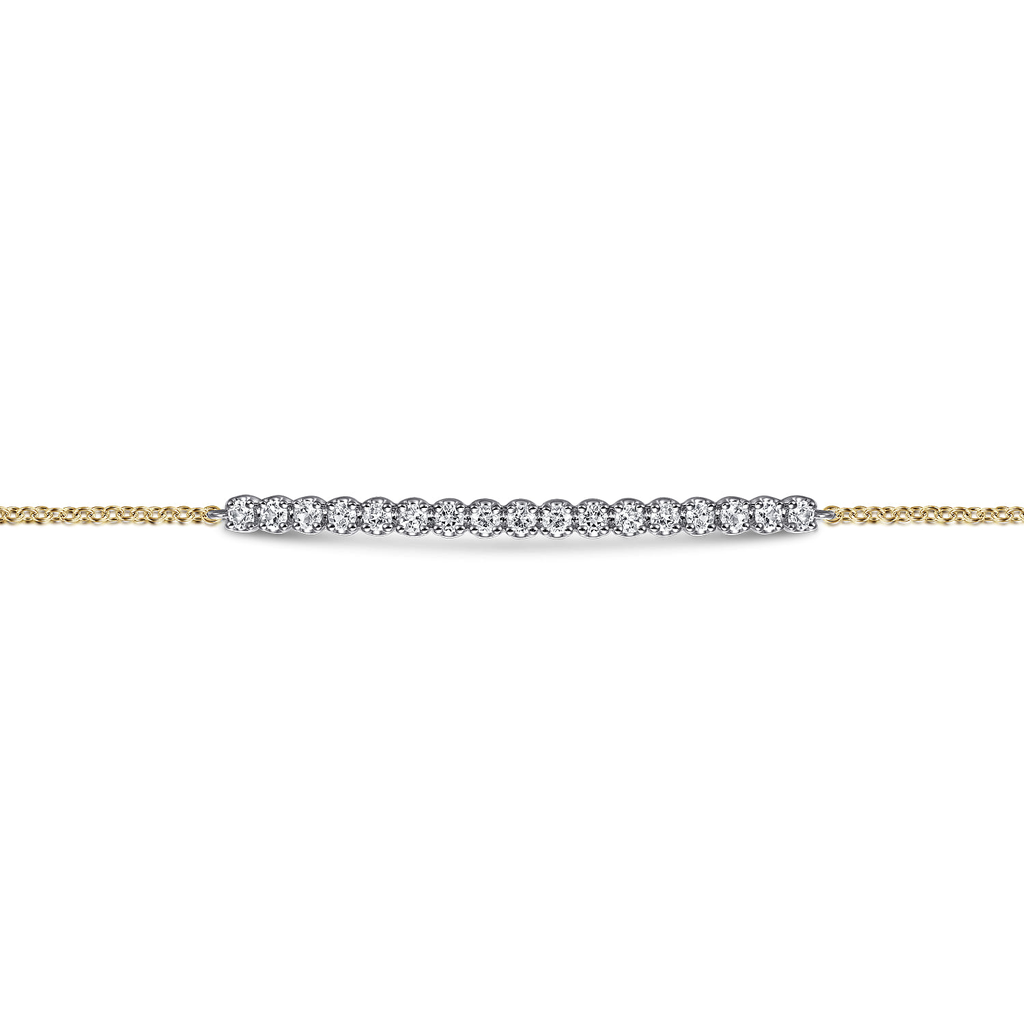 gold bracelet with white stones on white background