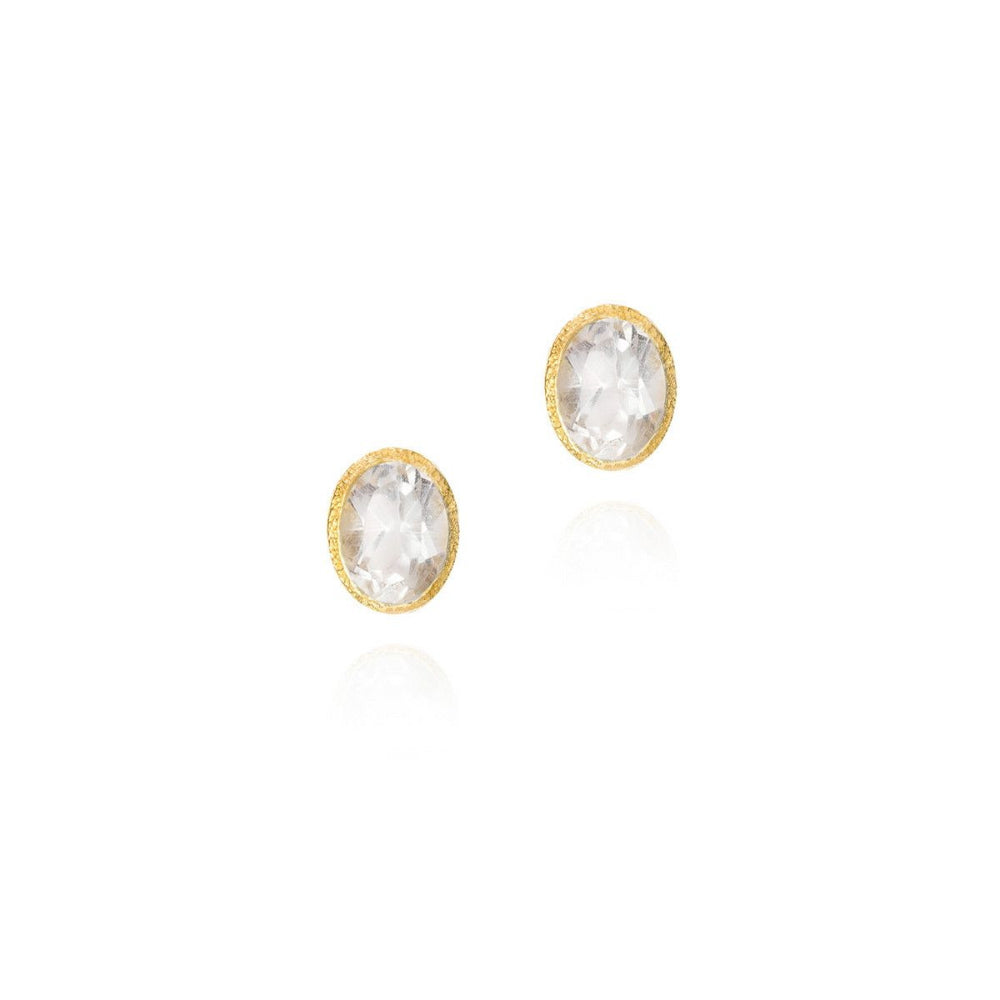 Pair of round earrings with gemstones on a white background
