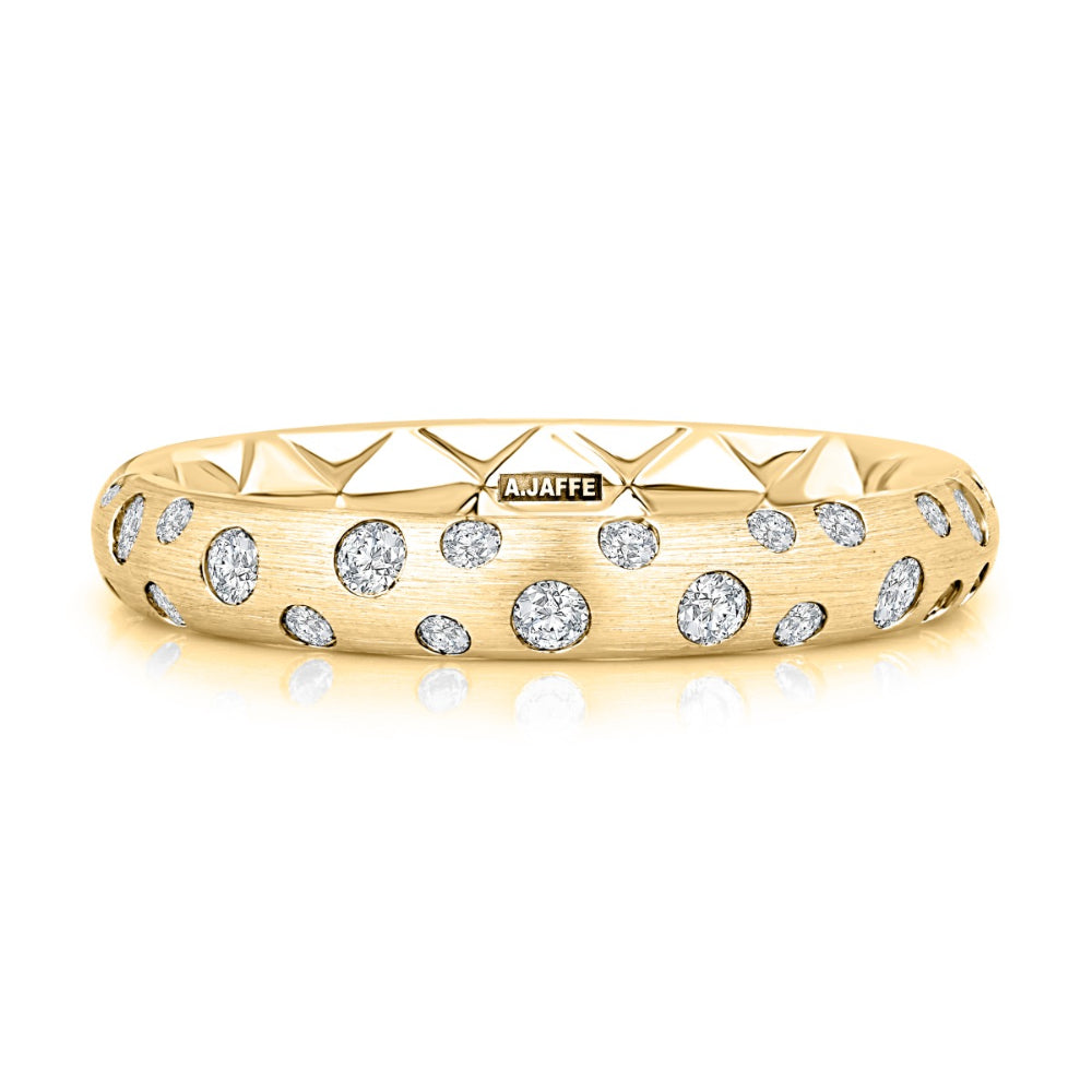 gold ring with clear stones on a white background