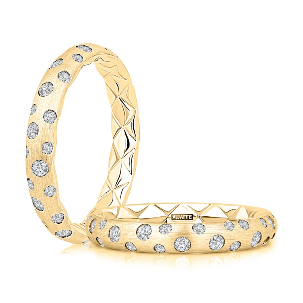 gold rings with clear stones on white background