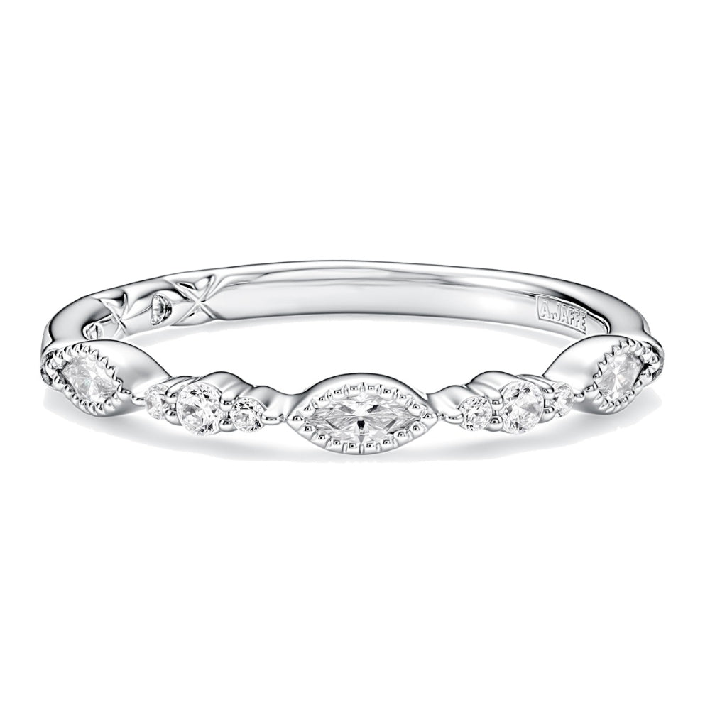silver tone ring with clear stones on white background