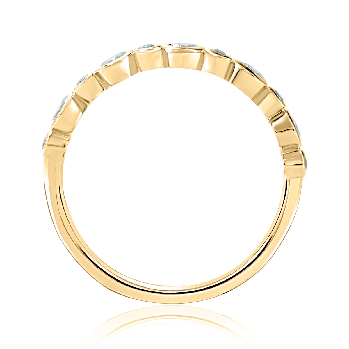 A yellow gold eternity ring featuring a continuous row of round-cut clear gemstones set in a beveled, raised profile, shown against a solid white background with a soft reflection below.