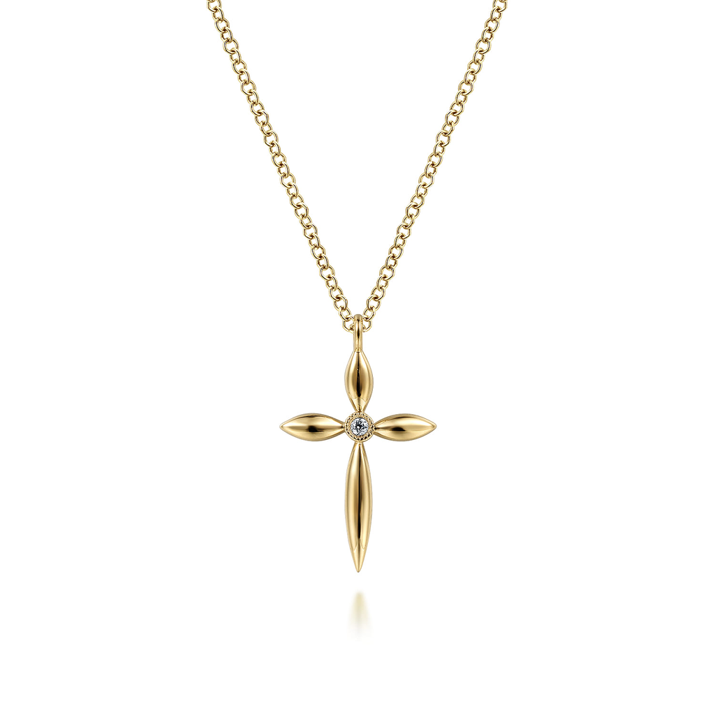 Gold cross pendant necklace on a white background