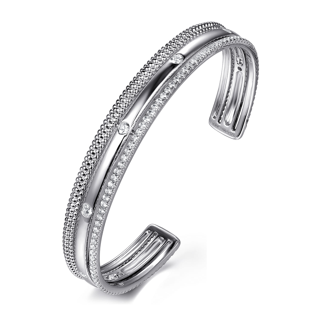 Silver bracelet with small stones on a white background