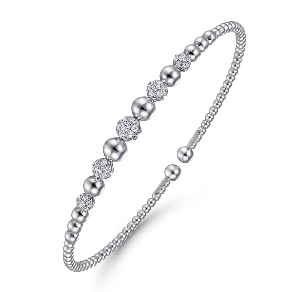 silver beaded bangle bracelet with clear stones on white background
