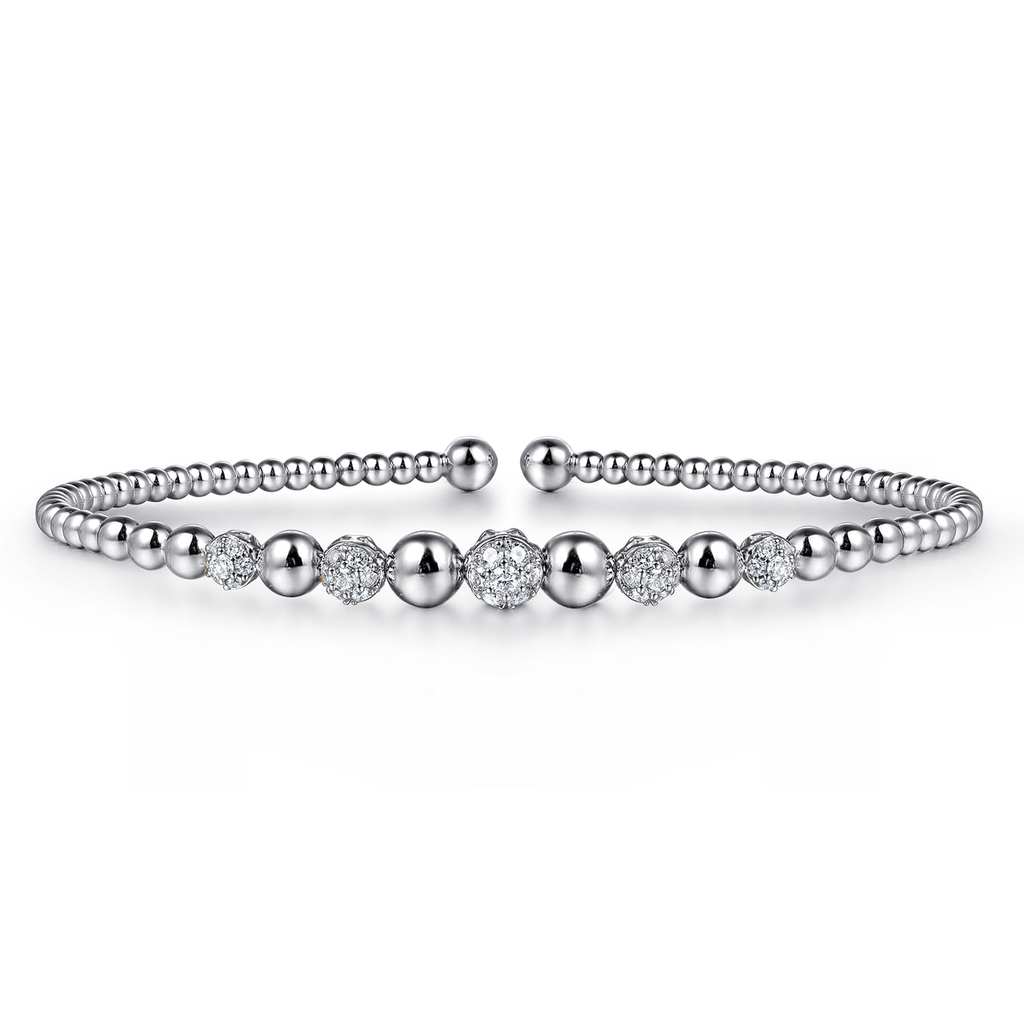 silver beaded bangle bracelet with clear stones on white background