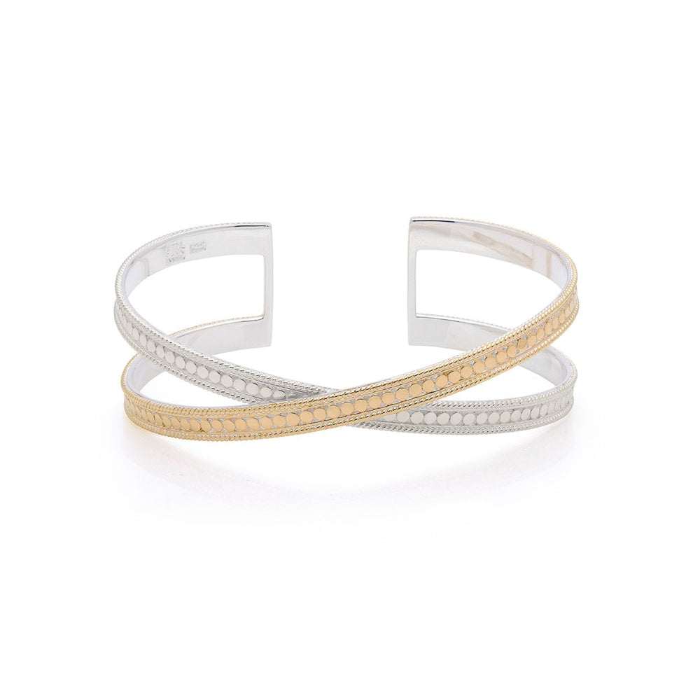 A two-tone Anna Beck Classic Cross Cuff, with gold plating and sterling silver, featuring a bracelet-style design with dots and a cuff structure.