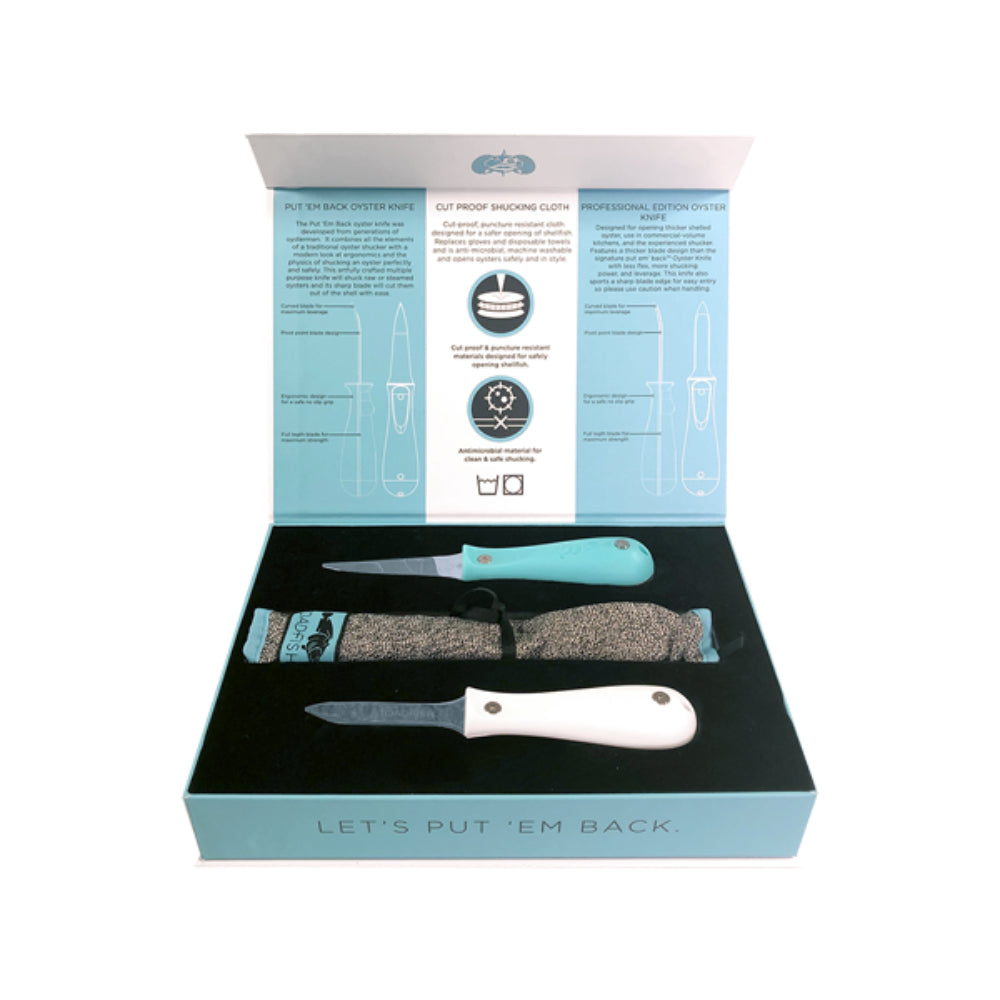 Oyster shucking kit with two knives and a cleaning cloth in an open box on a white background.