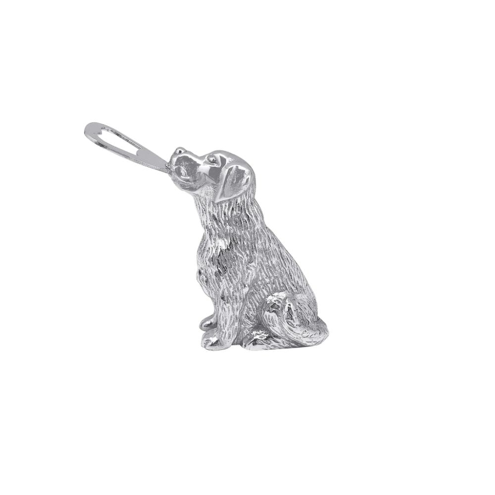 A bottle opener shaped like a sitting lab on a white background. 