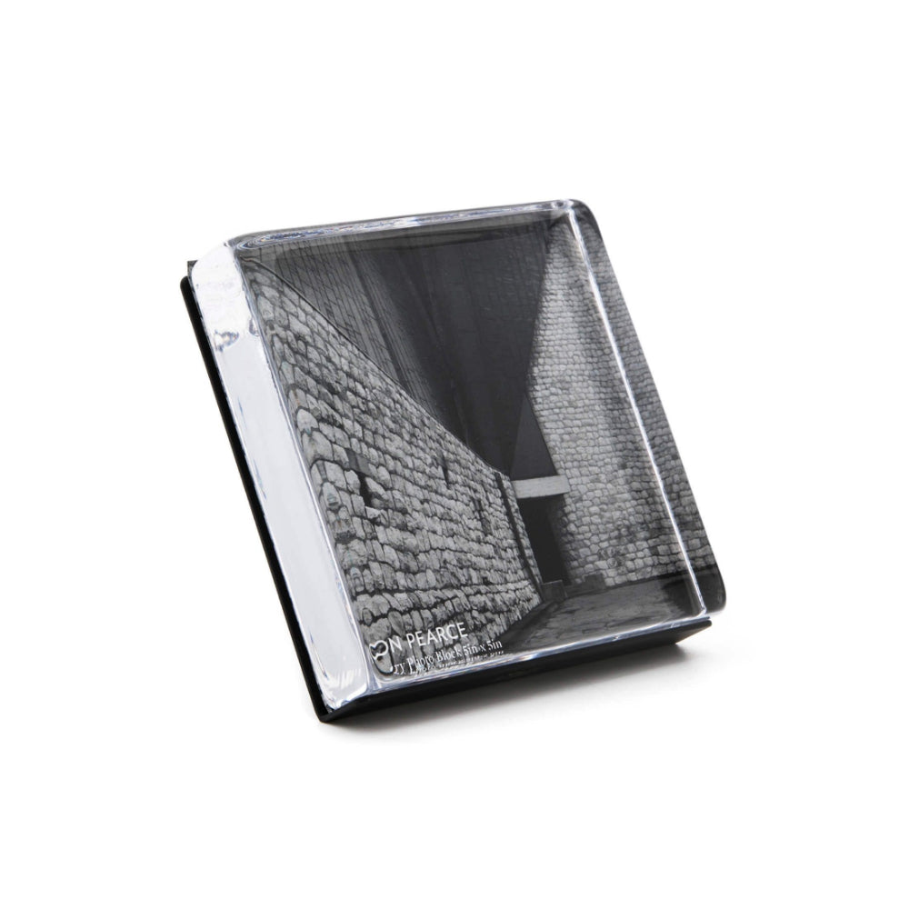 An angled side photo of the Simon Pearce Woodbury Square Photo Block on a white backround.