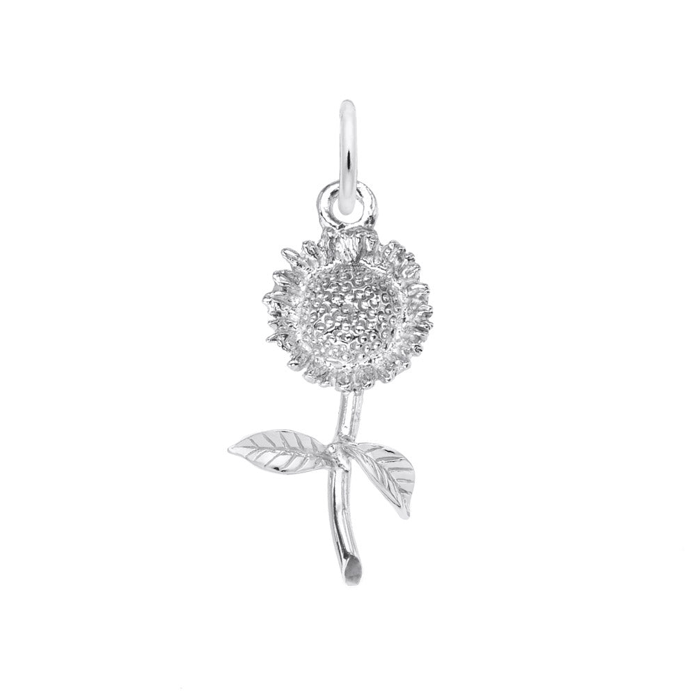 A silver charm in the shape of a small sunflower with a stem and two leaves.