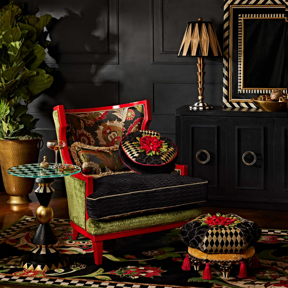 MacKenzie-Childs Gambit Accent Table in a black accented room 