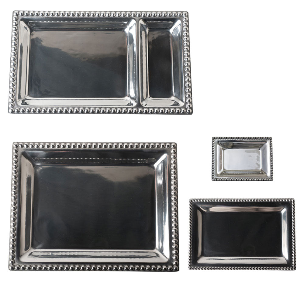 Differant sized silver rectangular trays with decorative edges on a white background.