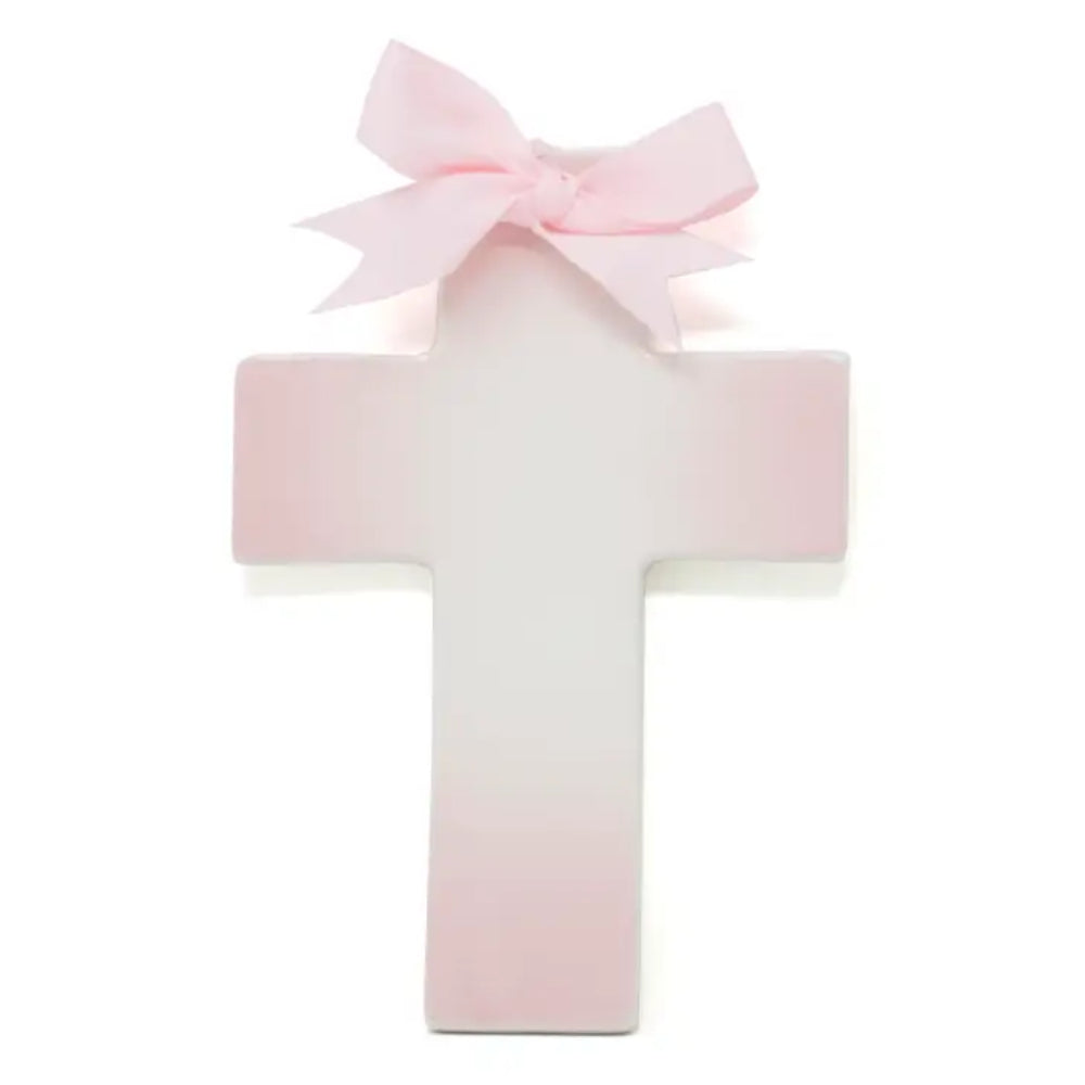 A pink and white cross a with a pink bow on top against a white background