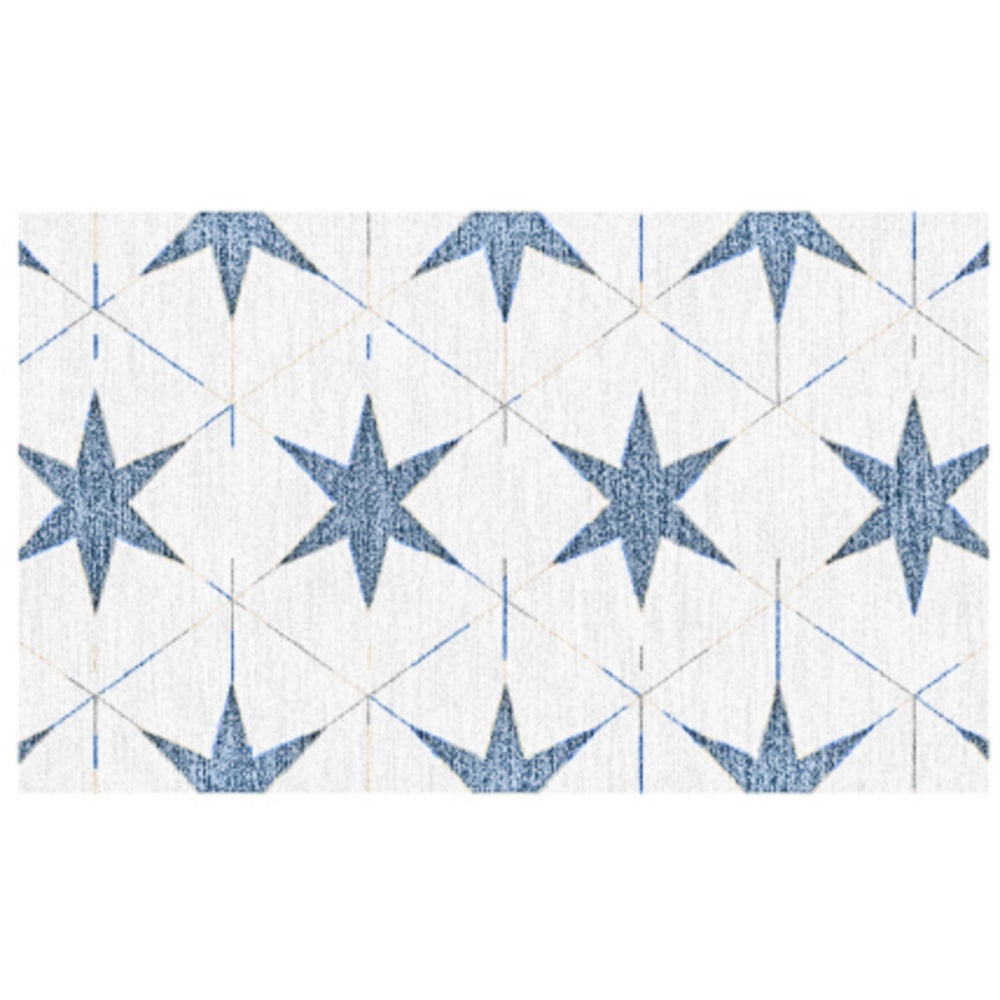 A rectangular indoor/outdoor rug with a pattern of blue stars on a white background.