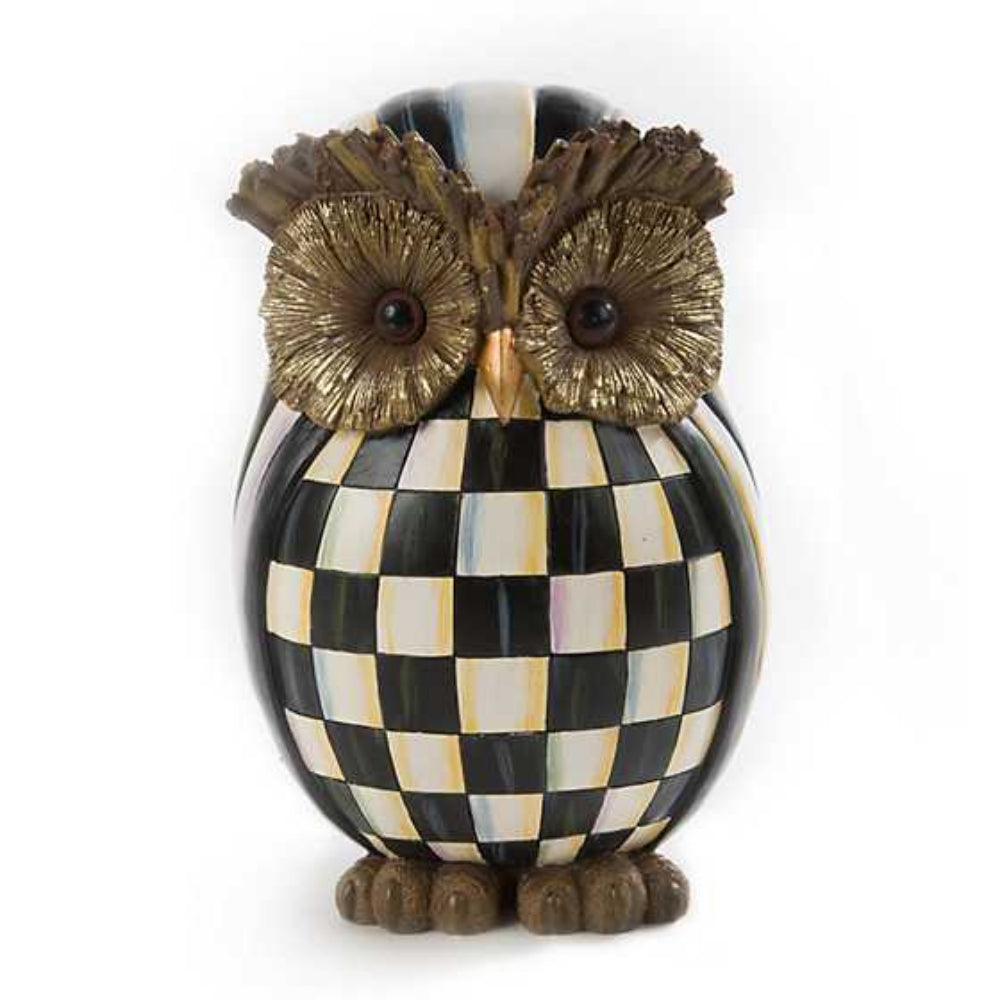 Decorative owl figurine with checkered pattern on a white background