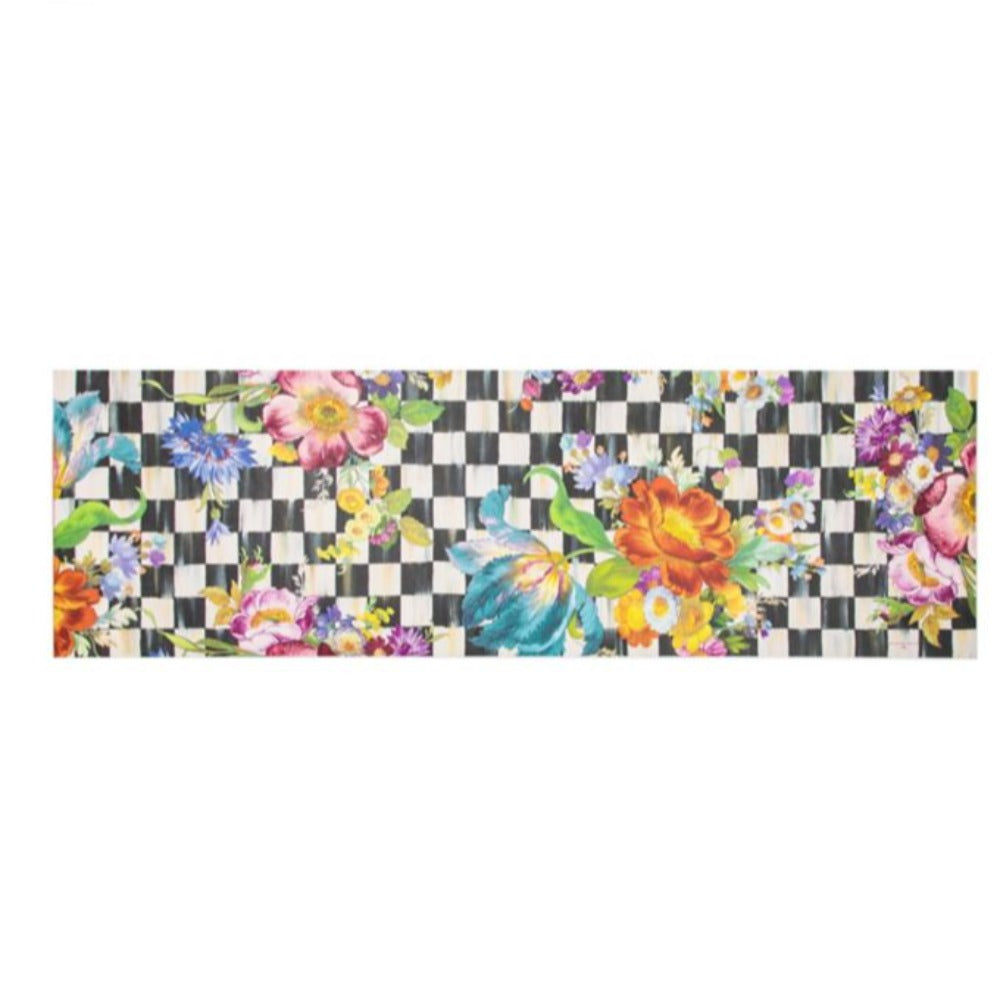 A Large size 2'6'x 8' colorful floral design doormat on a black and white checkered background