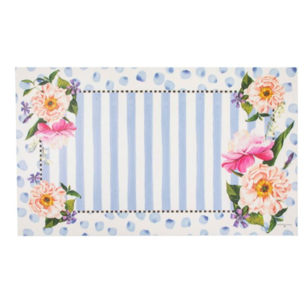 A medium size 3'x5' doormat with floral design and blue polka dots on a white background
