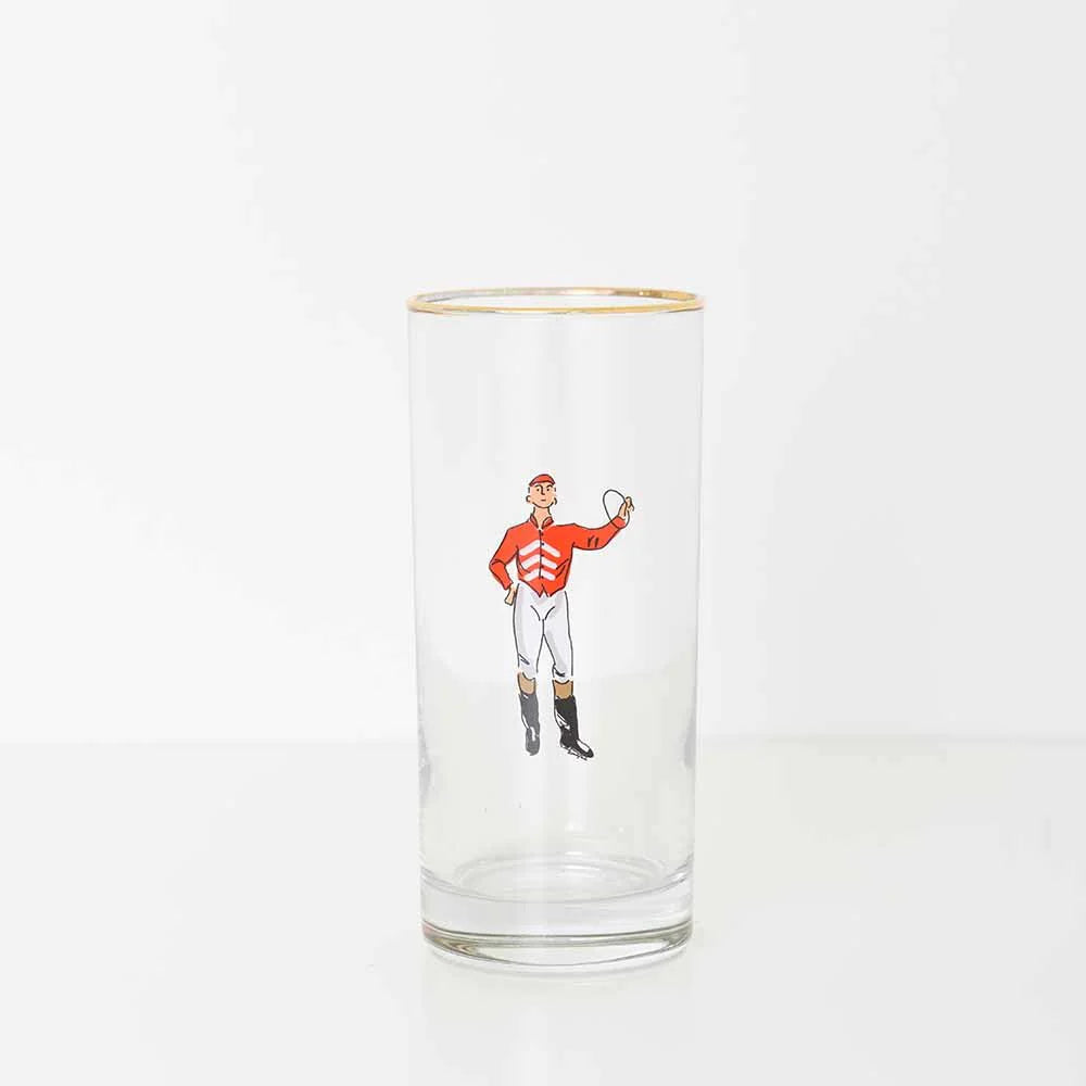 A bourbon glass with a red jockey on a white background. 