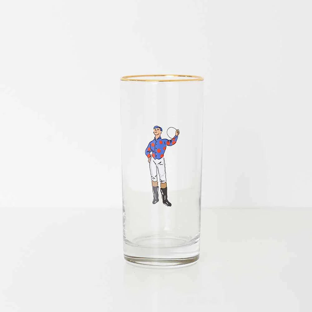 A bourbon glass with a blue and red jockey on a white background. 