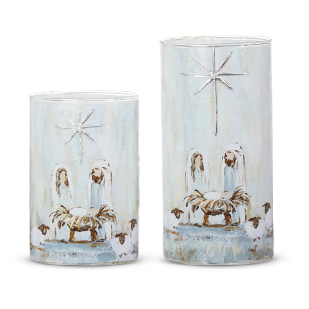 Two cylindrical containers with nativity scene design on a white background.