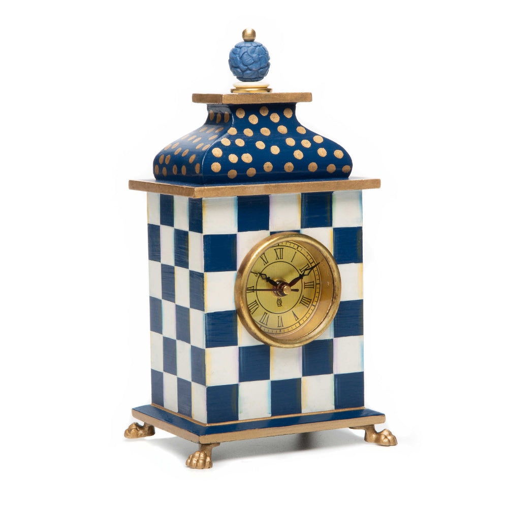 Decorative clock with royal blue and white checkered design on a white background