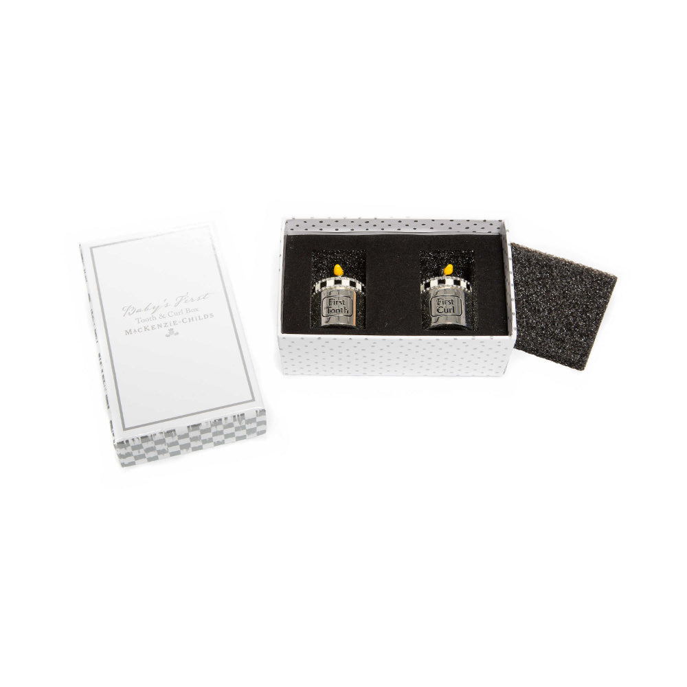  Two silver and  black & white checkered tops and silver duck topings with yellow beeks containers. Labeled 'First Tooth' and 'First Curl' in a white & grey checkared box with black foam packaging on a white background.