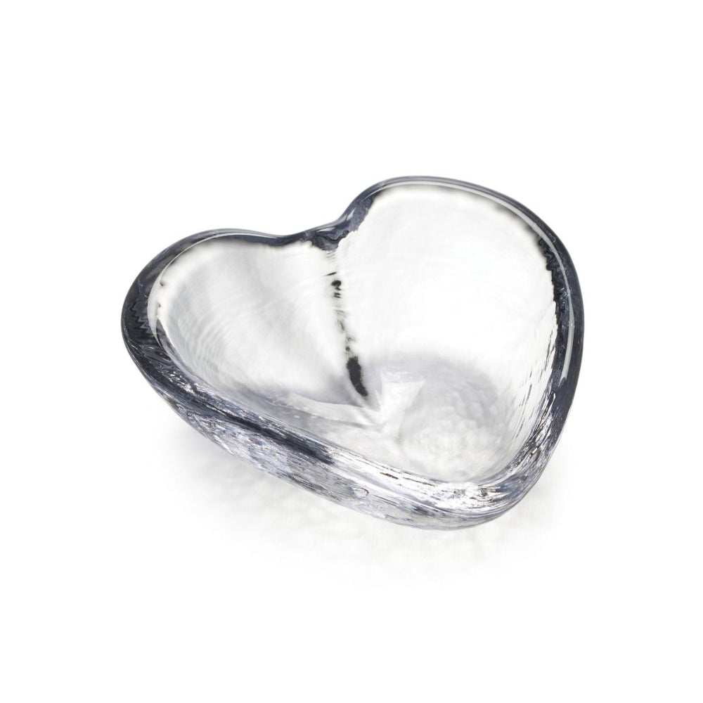 Clear glass heart-shaped bowl on a white background