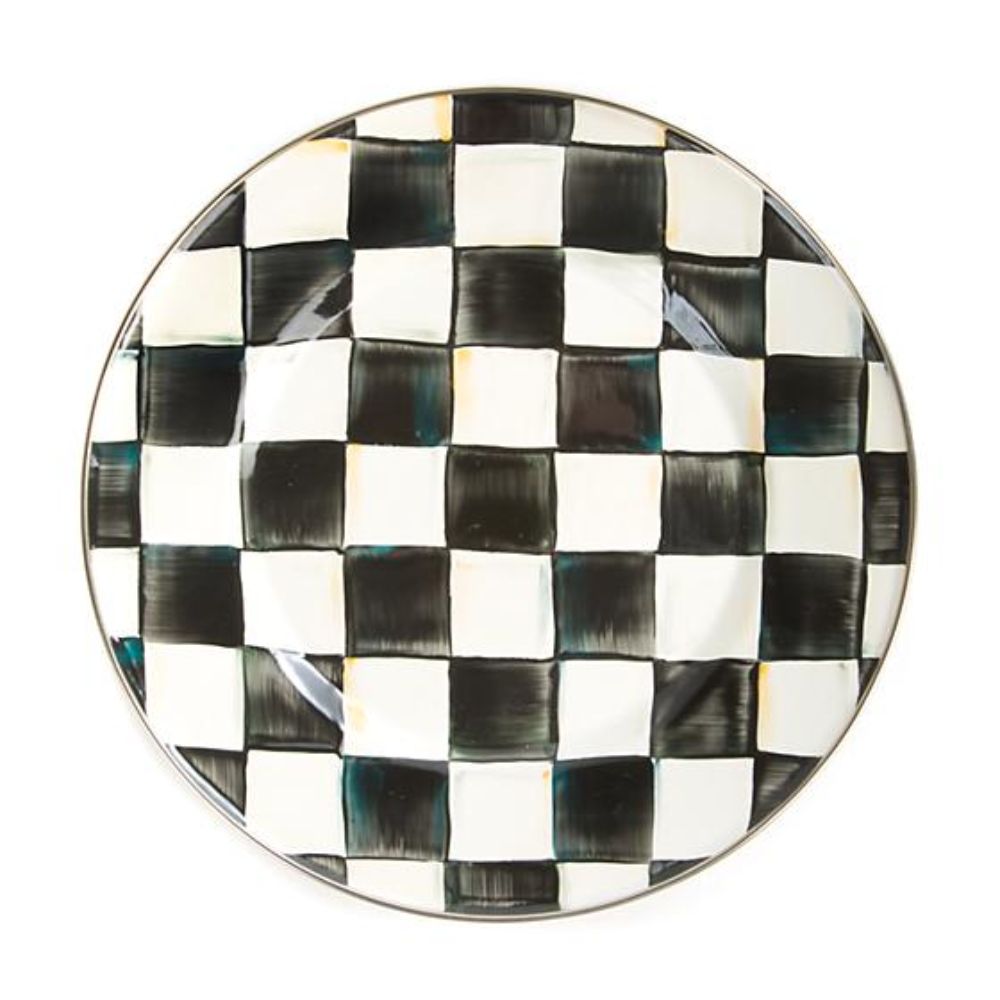 Round plate with black and white with a checkered pattern on a white background