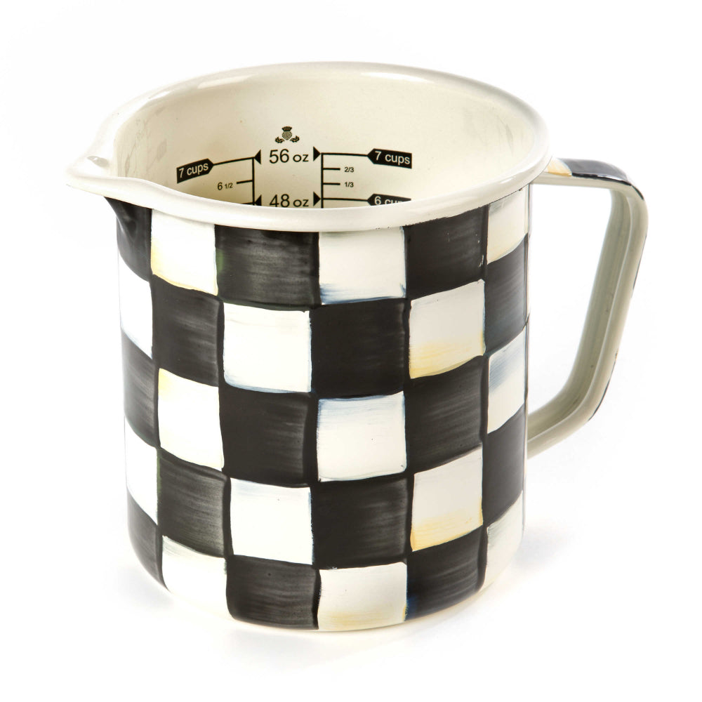 Measuring cup with black and white checkered pattern on a white background