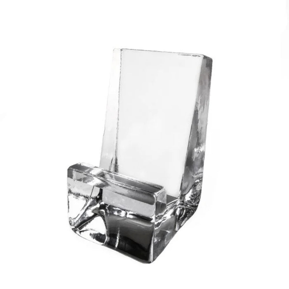Clear glass phone holder on a white background.
