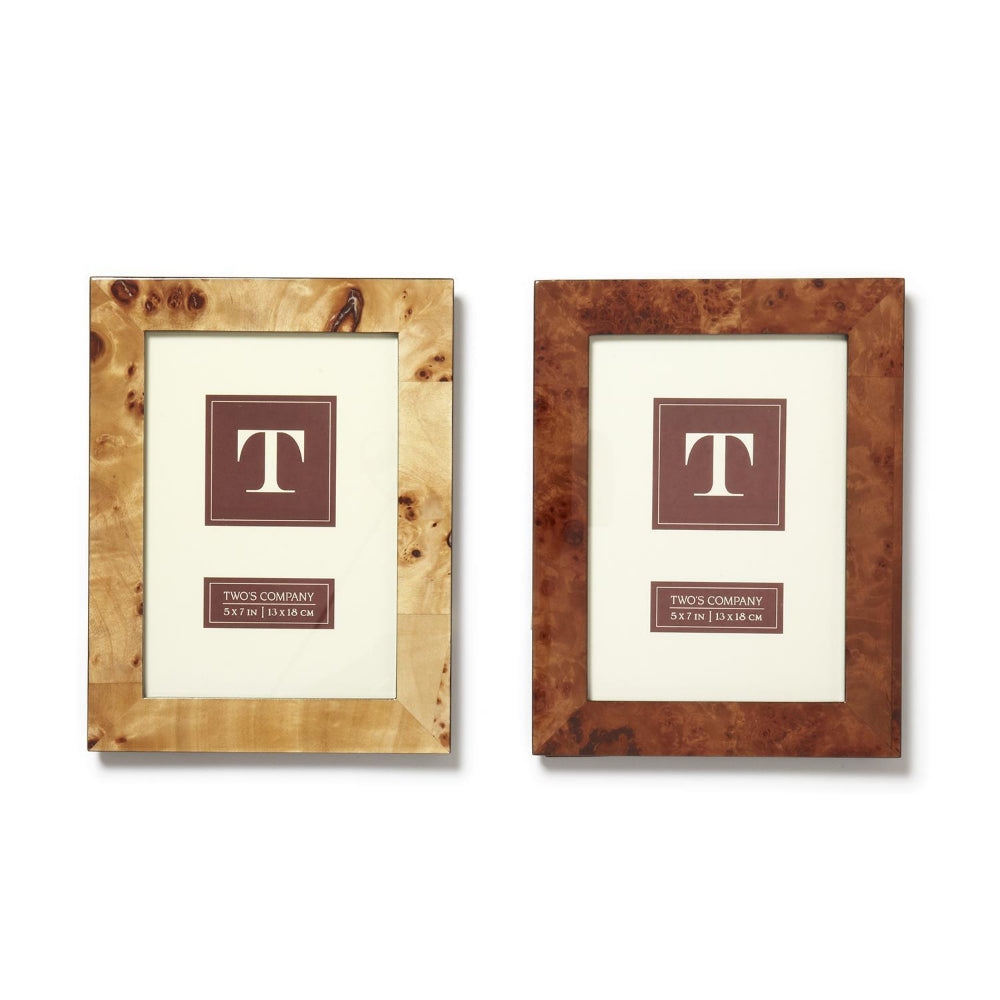Two wooden photo frames, one with a light brown finish and the other with a dark brown finish, both with a glossy lacquered finish and displaying a portrait orientation. They are pictured against a white background.