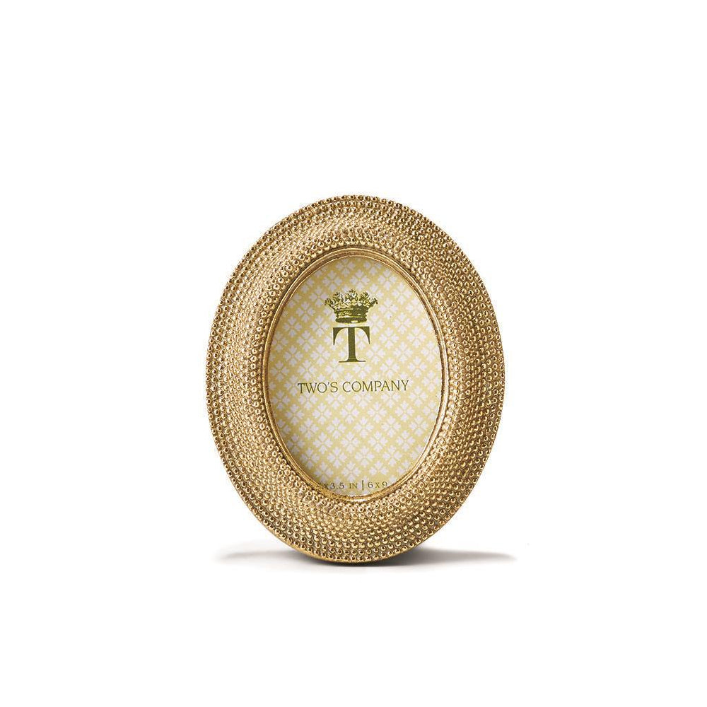 2.5x3.5 oval golden picture frame on a white backround. 