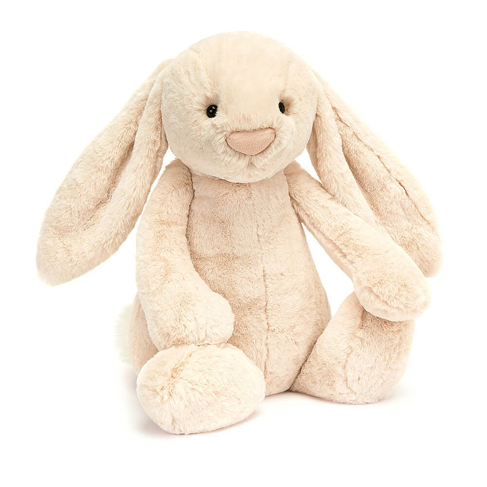 A plush toy resembling a bunny with a beige color, long ears, and a soft fur texture. The bunny has a simple, friendly facial expression with a nose detailed with sparkling thread.