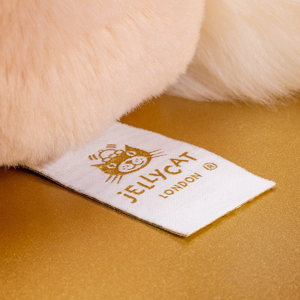 A tag with Jellycat London on it attached to a fur stuffy. 